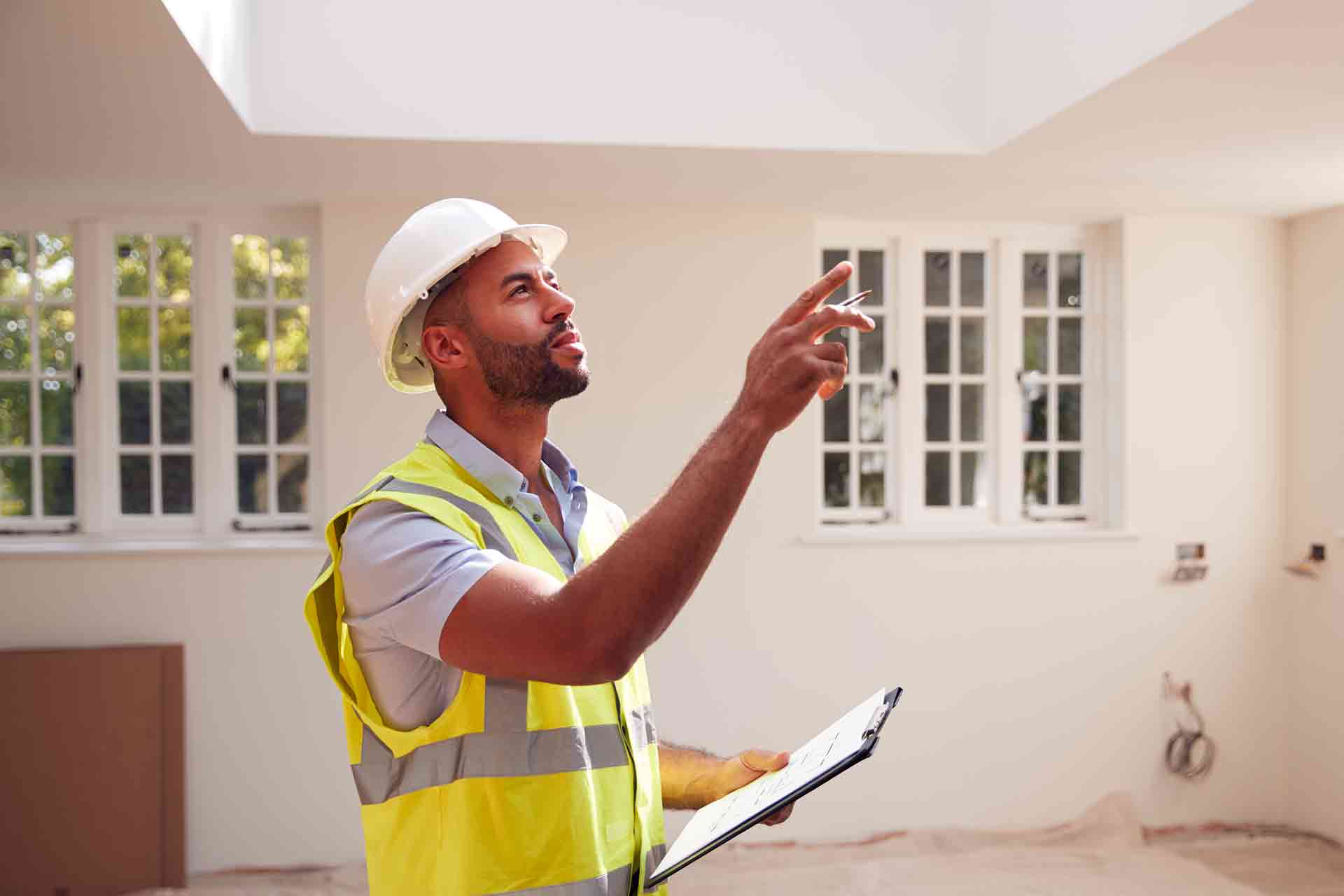 Third Party Wall Surveyors Blackpool reviewing plans between two parties during a dispute